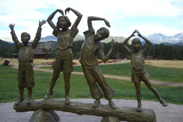 bronze statue of children at YMCA in Estes